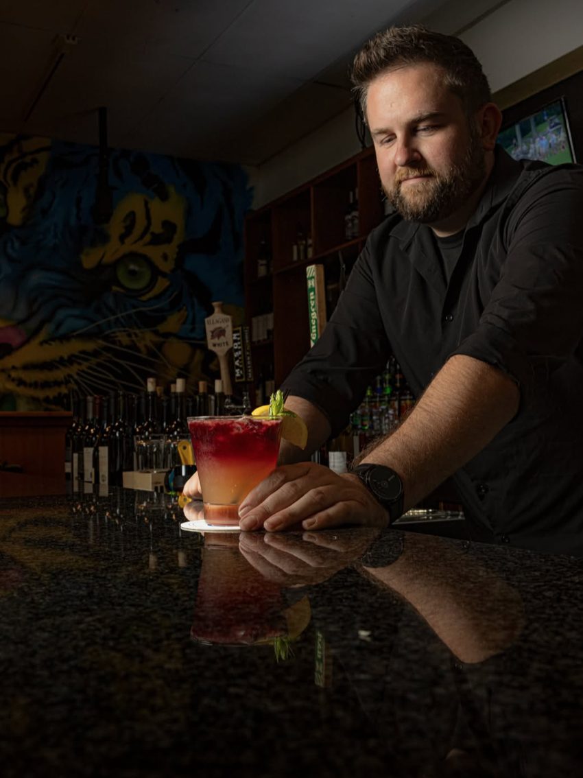 Oakmont bartender with a finished craft cocktail